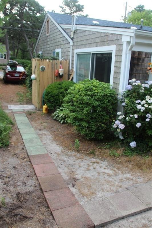 55 Captain Chase Road Dennis Port, MA 02639 - Photo 5 of 18 a view of a house with a backyard