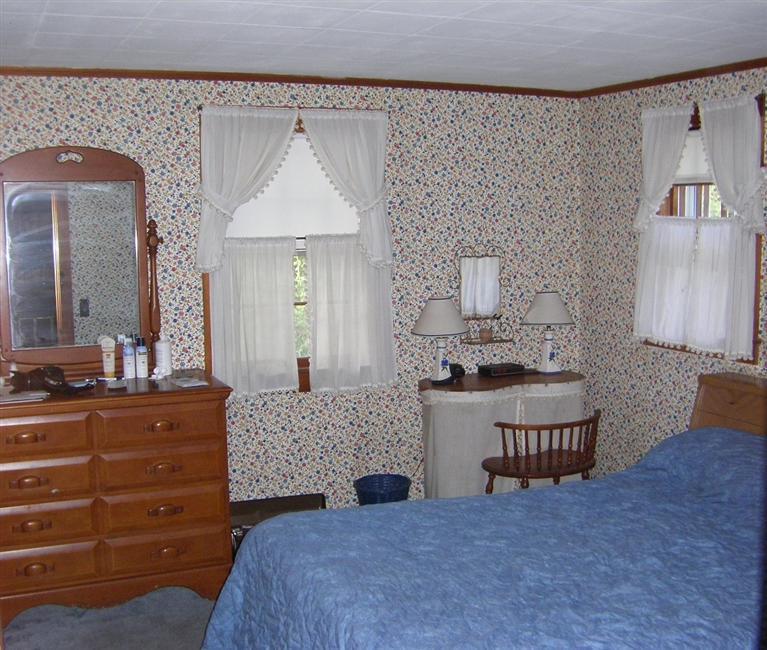 55 Captain Chase Road Dennis Port, MA 02639 - Photo 7 of 18 a bedroom with a bed and a dresser