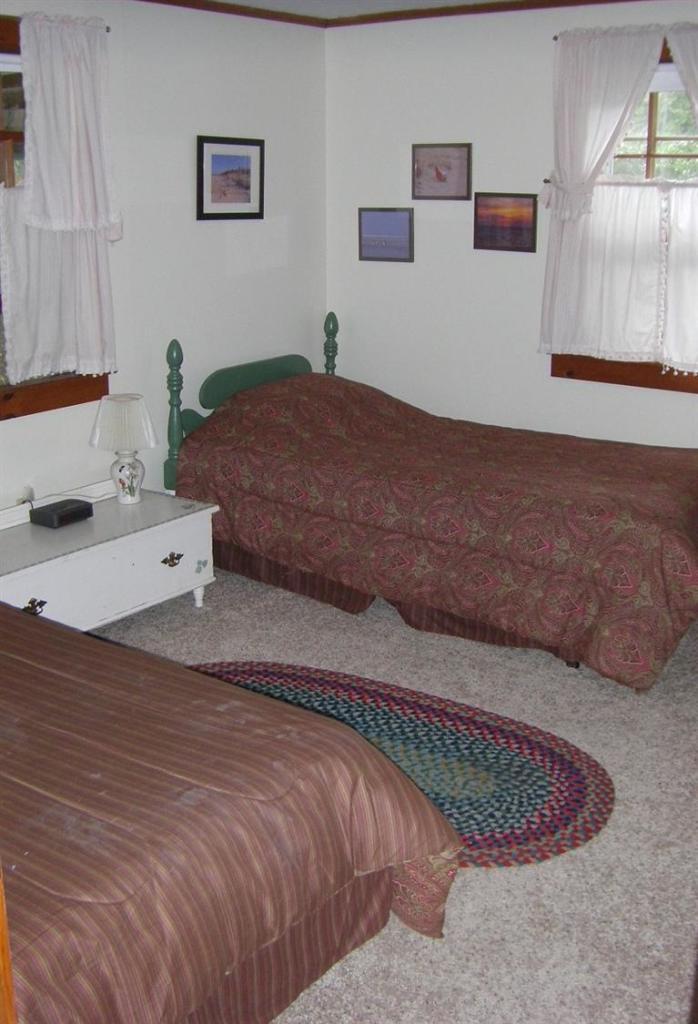 55 Captain Chase Road Dennis Port, MA 02639 - Photo 8 of 18 a bedroom with a bed and window
