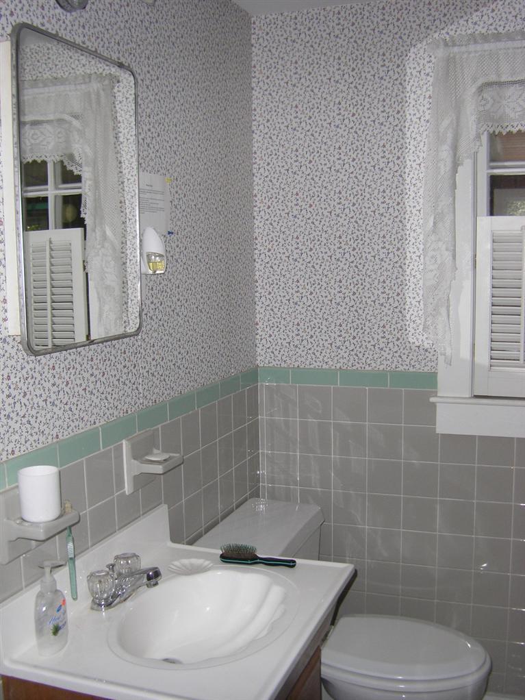 55 Captain Chase Road Dennis Port, MA 02639 - Photo 10 of 18 a bathroom with a sink a toilet and mirror