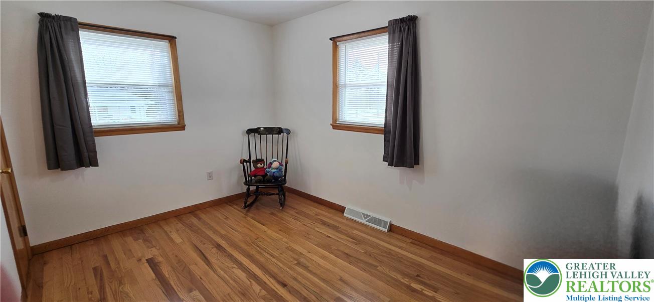 315 Long Lane Road Walnutport, PA 18088 - Photo 16 of 41 an empty room with wooden floor and windows