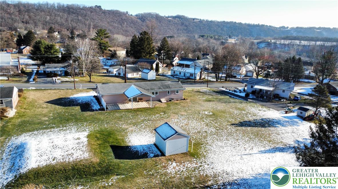 315 Long Lane Road Walnutport, PA 18088 - Photo 33 of 41 a swimming pool with outdoor seating and mountain view