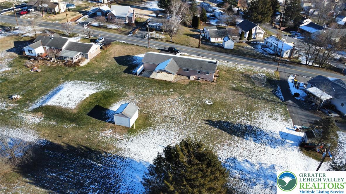315 Long Lane Road Walnutport, PA 18088 - Photo 34 of 41 a large swimming pool with some trees in the background