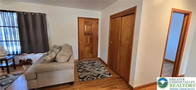 a bedroom with furniture and a window