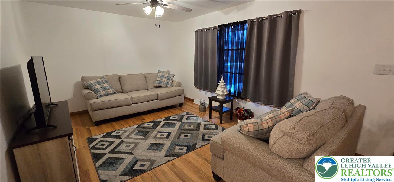 315 Long Lane Road Walnutport, PA 18088 - Photo 7 of 41 a living room with furniture a couch and a chandelier