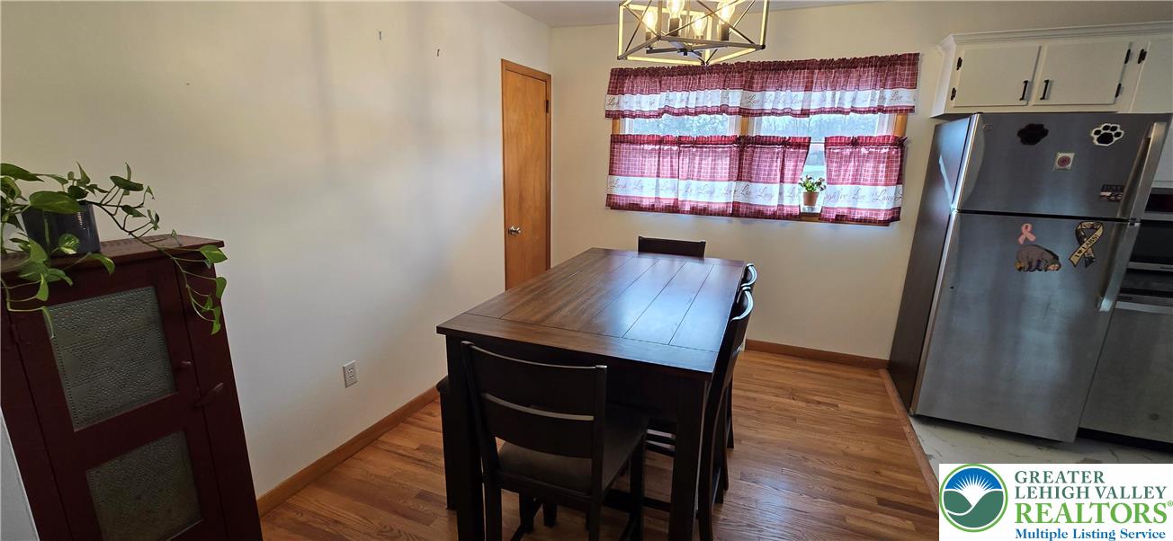 315 Long Lane Road Walnutport, PA 18088 - Photo 10 of 41 a kitchen with a refrigerator and a table