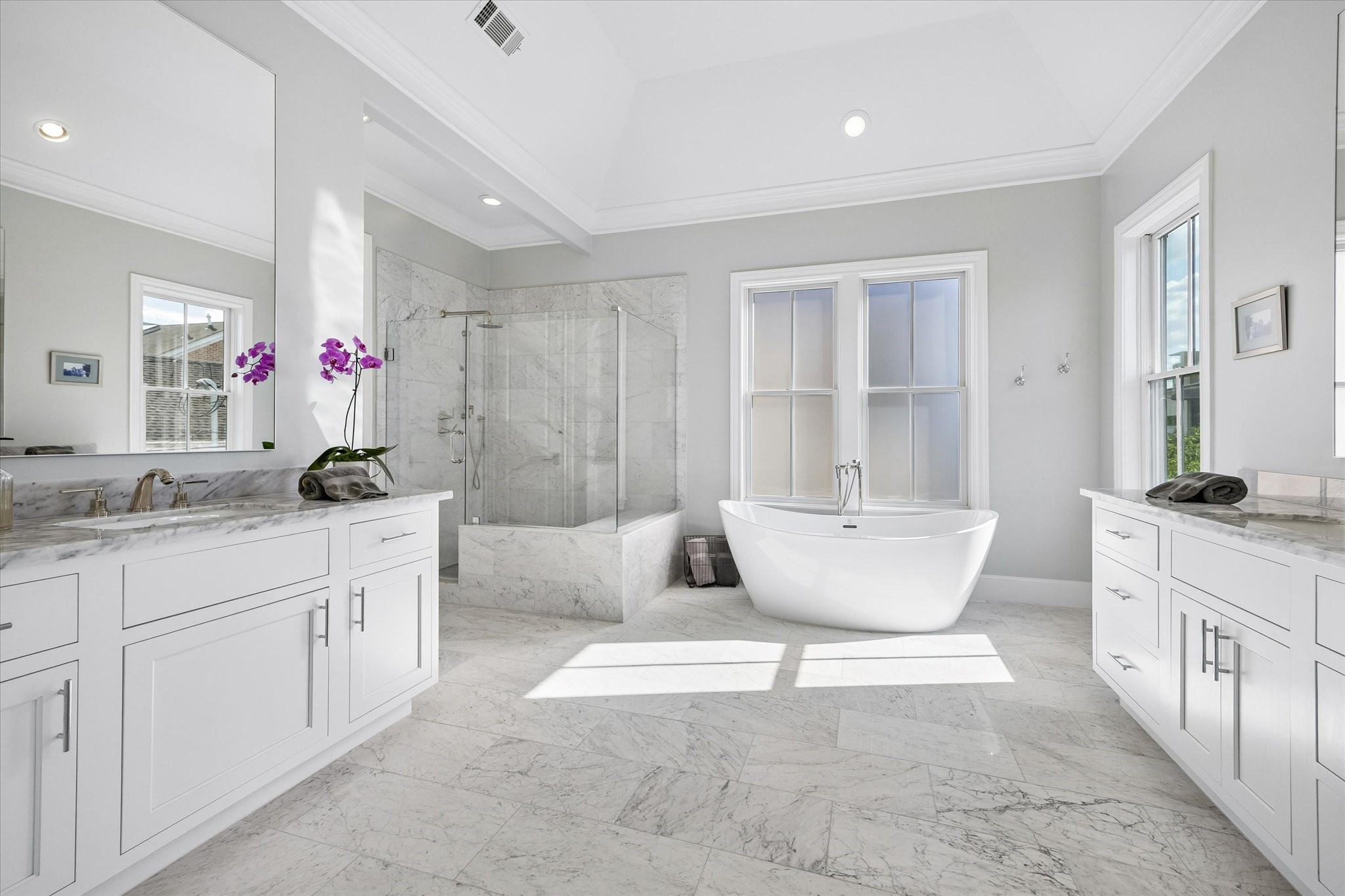 3020 Lake Street Houston, TX 77098 - Photo 26 of 43 The primary bath has two separate sink vanities, a soaking tub, and walk-in shower.