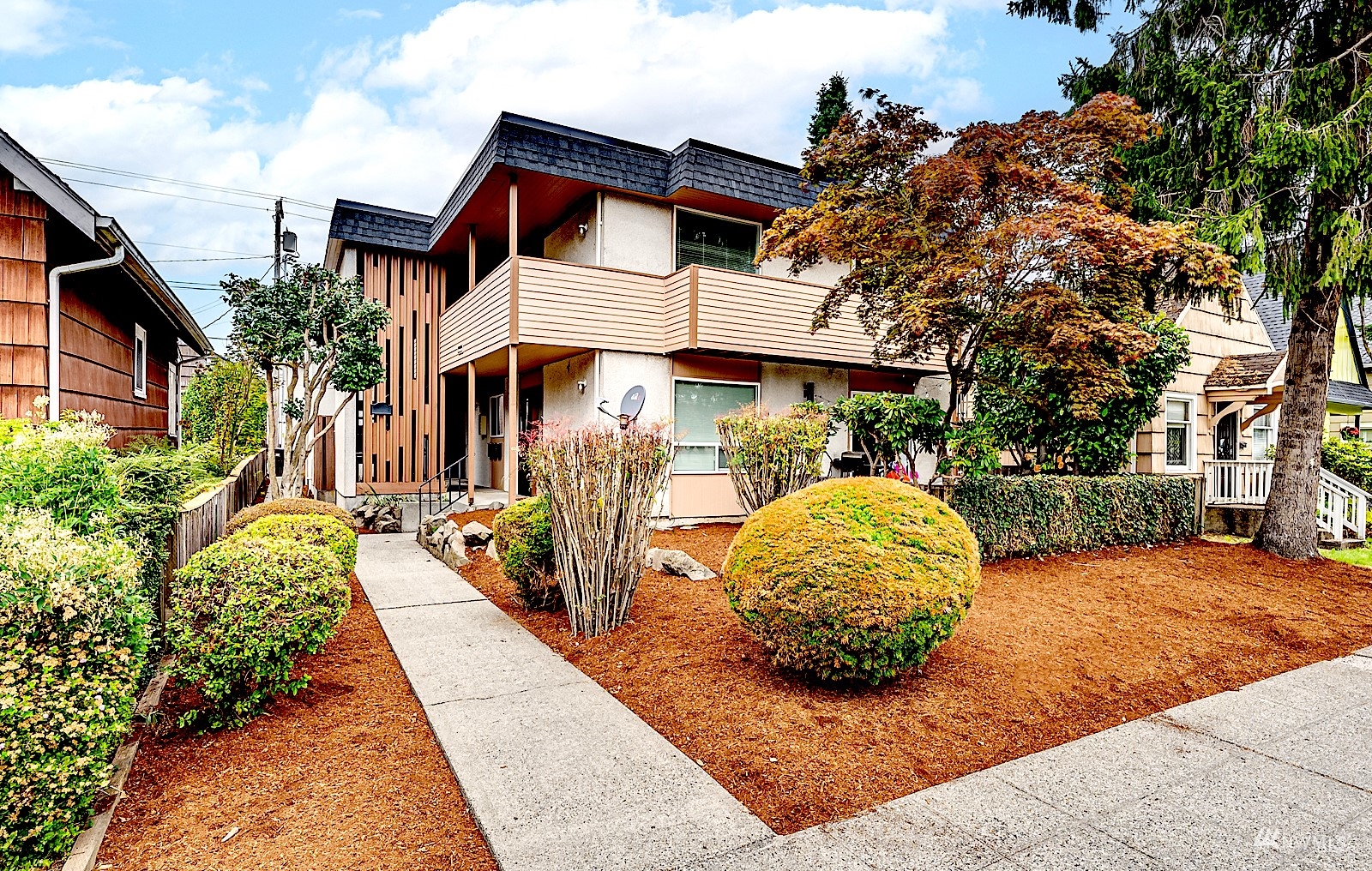 a front view of a house with garden