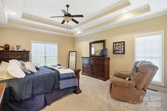 a bed room with a bed window and a couch