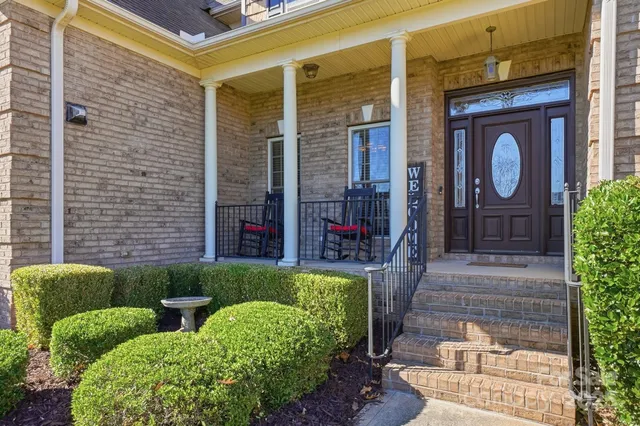 a front view of a house with garden