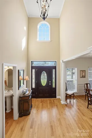 a living room with a table and a fireplace