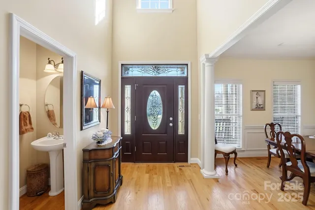 a living room with furniture a fireplace and a table