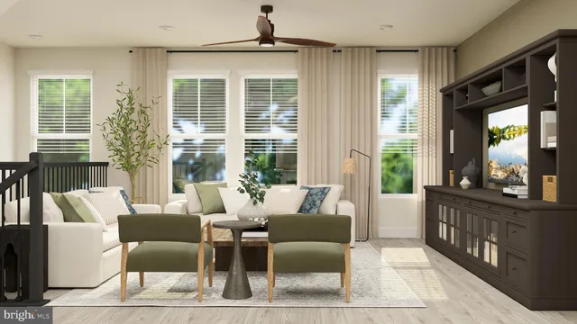 a living room with furniture and large windows