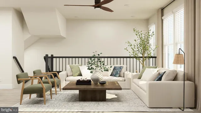 a living room with furniture and floor to ceiling windows