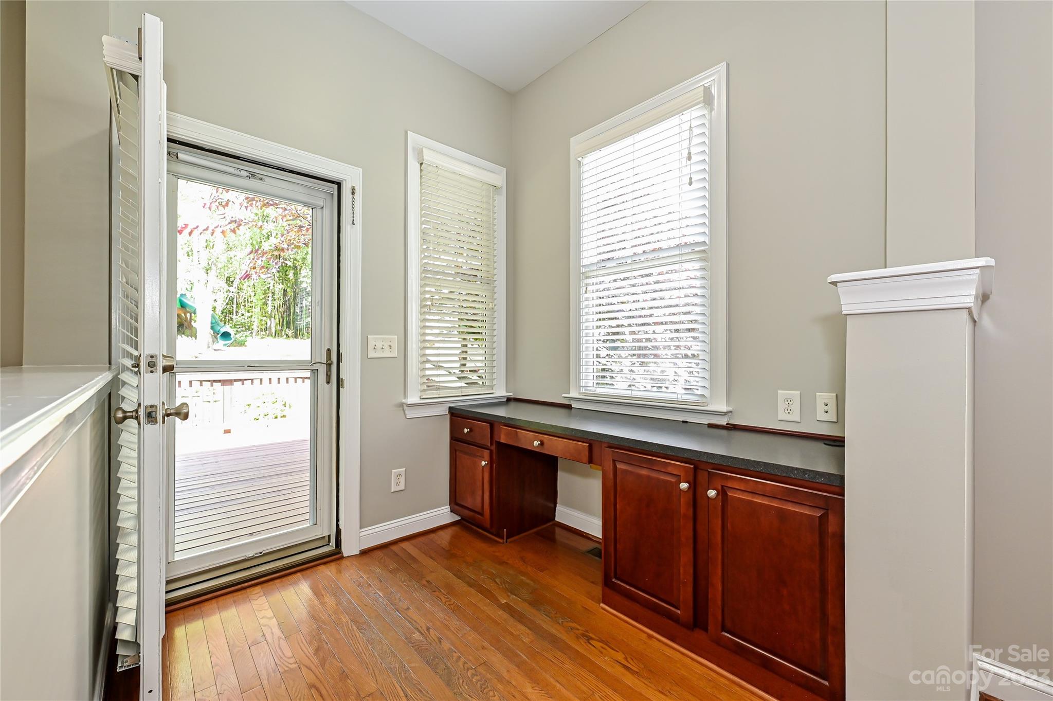 105 Mills Lane Fort Mill, SC 29708 - Photo 15 of 41 a view of a large kitchen with wooden floor and a window