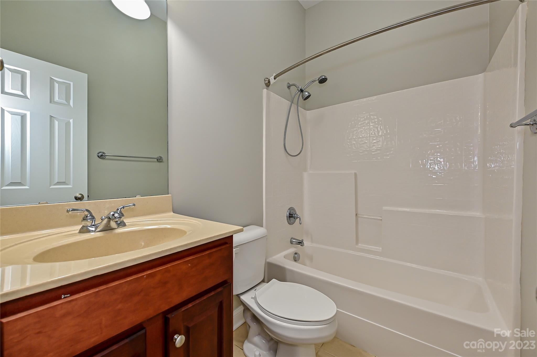 105 Mills Lane Fort Mill, SC 29708 - Photo 25 of 41 a bathroom with a sink a toilet and a bathtub