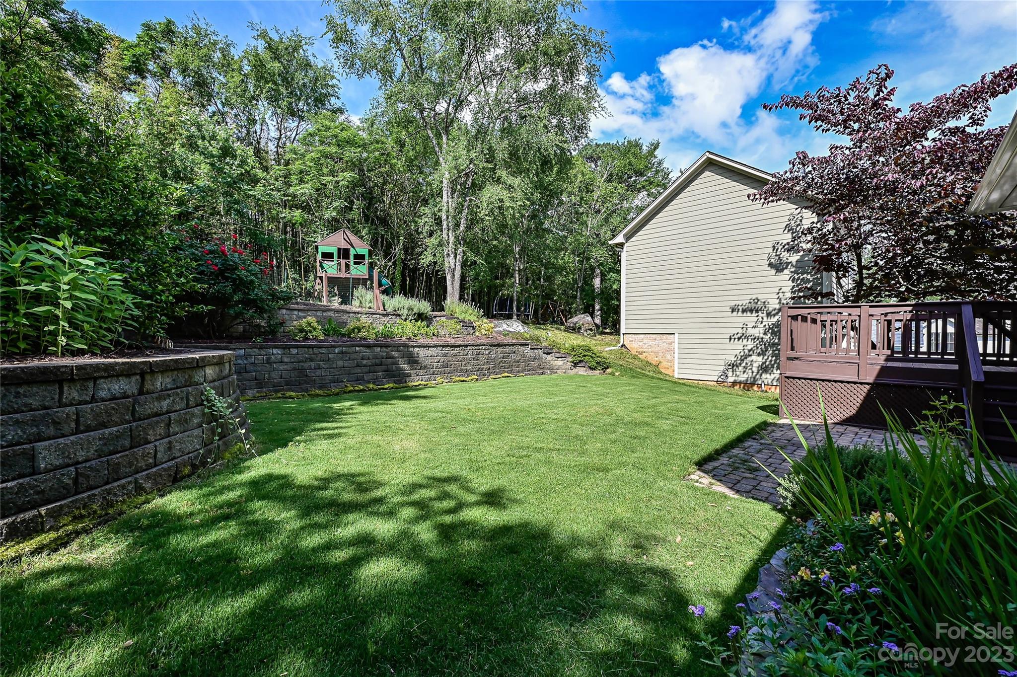 105 Mills Lane Fort Mill, SC 29708 - Photo 32 of 41 a view of backyard with seating area and green space