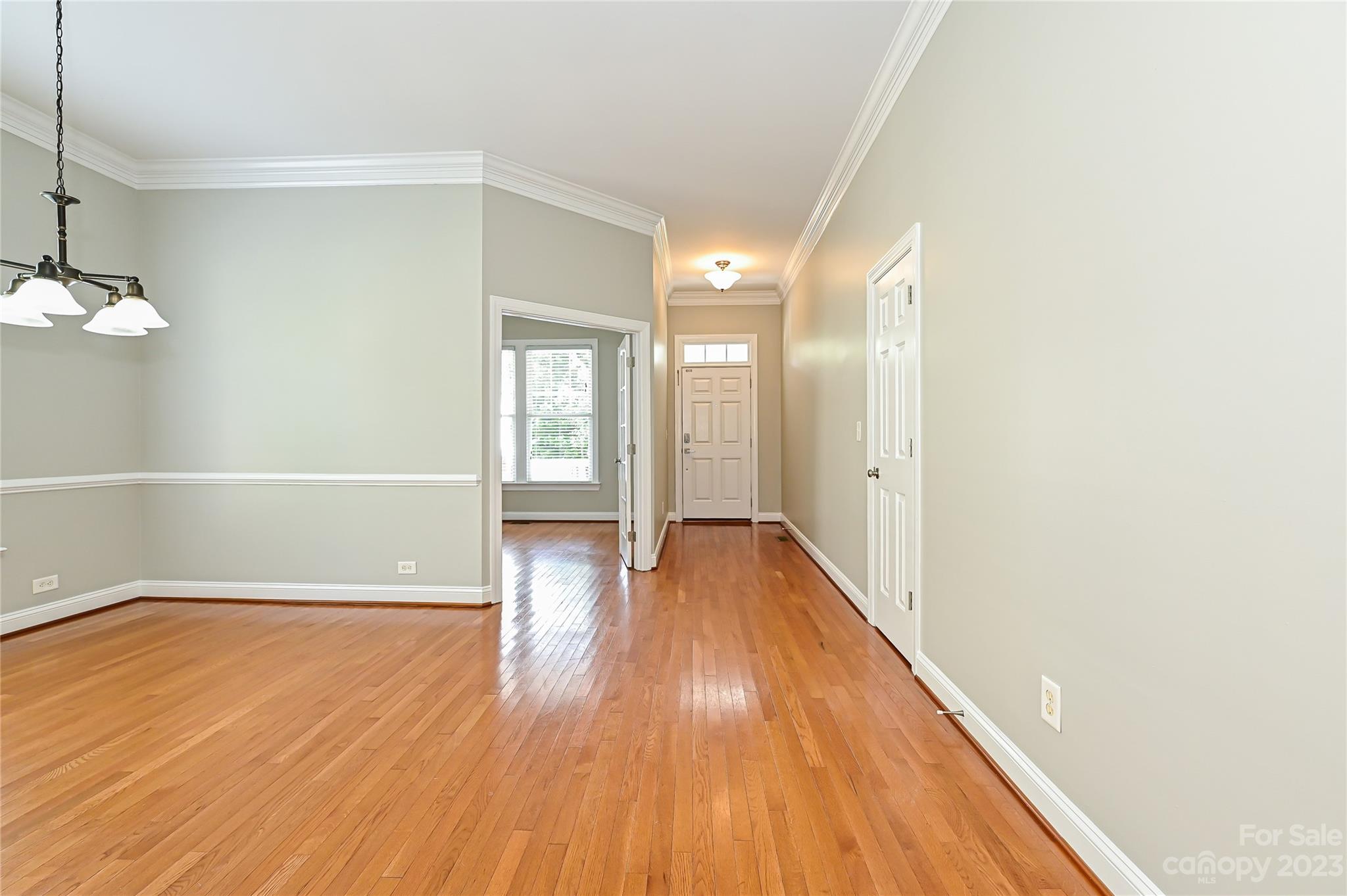 105 Mills Lane Fort Mill, SC 29708 - Photo 4 of 41 a view of a hallway with wooden floor
