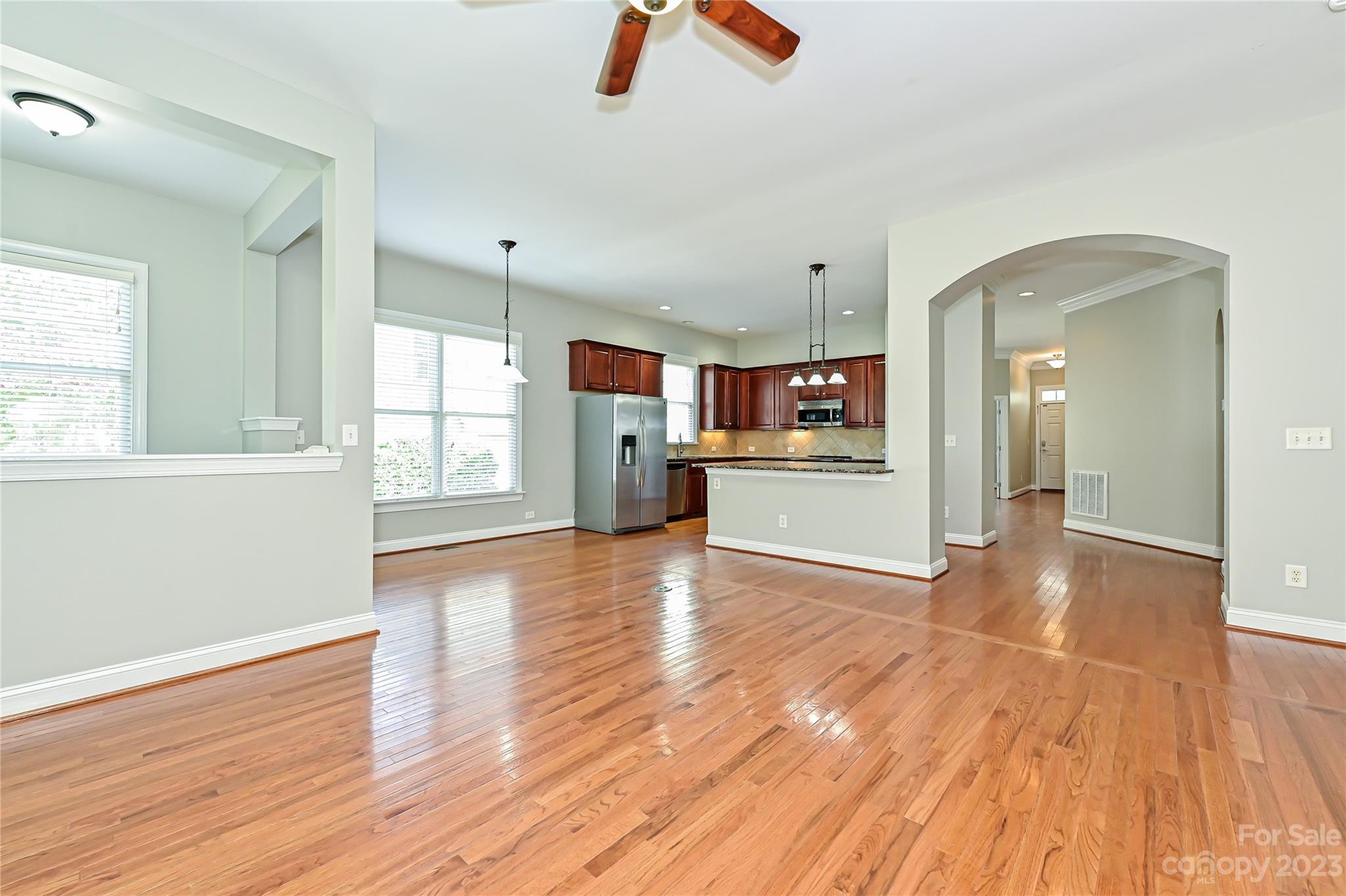 105 Mills Lane Fort Mill, SC 29708 - Photo 10 of 41 a view of a kitchen with furniture wooden floor kitchen view and windows