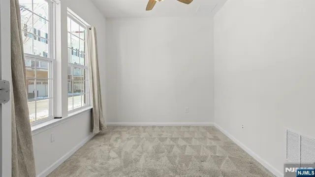 a kitchen with center island and stainless steel appliances
