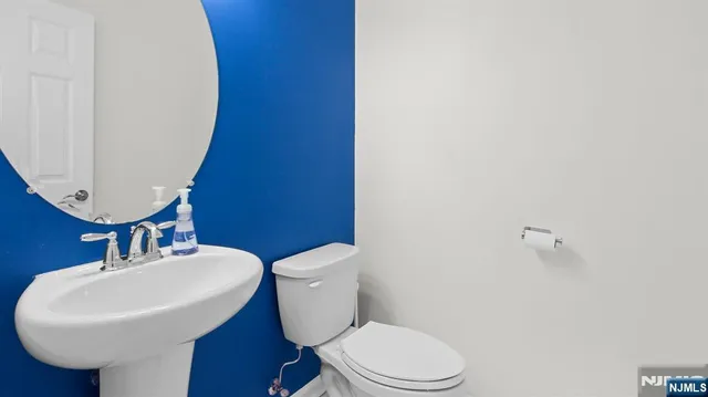 a kitchen with granite countertop a sink stove and cabinets