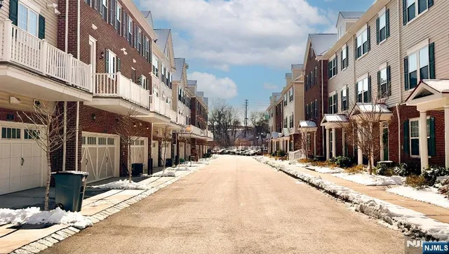 a view of a street with a building in the background