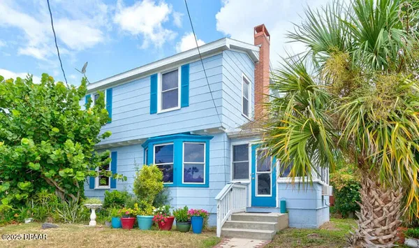 a front view of house with small garden
