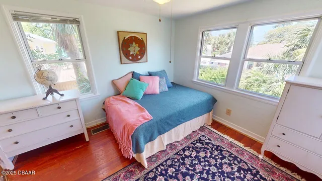 a bed room with a bed and a window