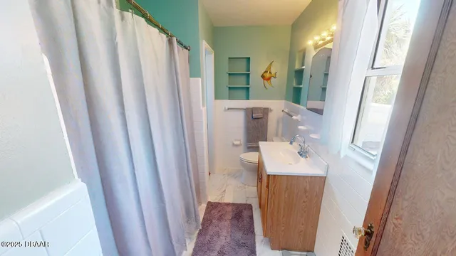 a bathroom with a sink a mirror and a shower