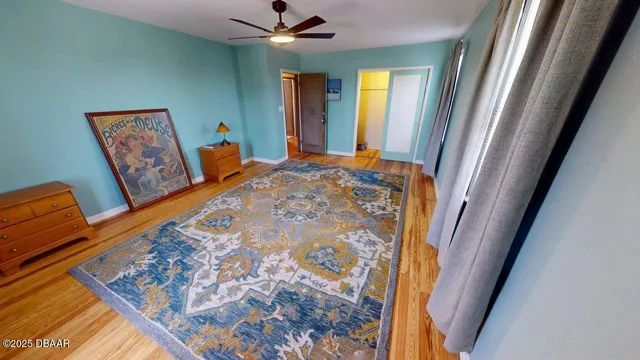 a view of a hallway with furniture and windows