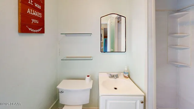 a bathroom with a toilet and a sink