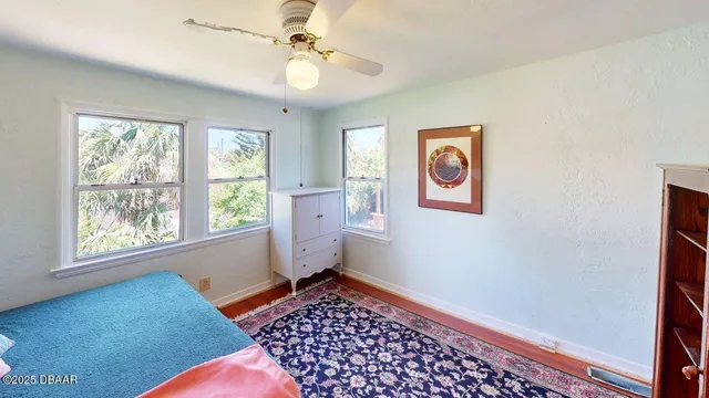 a bedroom with bed and a window