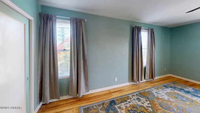 a view of a bedroom and window