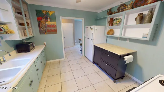 a room with a washing machine and sink