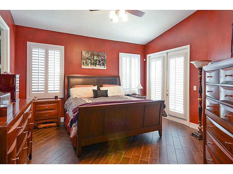 7070 Northwest Turtle Walk Boca Raton, FL 33487 - Photo 8 of 10 a bed room with a bed and a tv