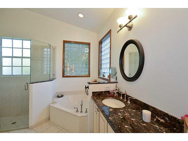 7070 Northwest Turtle Walk Boca Raton, FL 33487 - Photo 9 of 10 a bathroom with a sink and a mirror