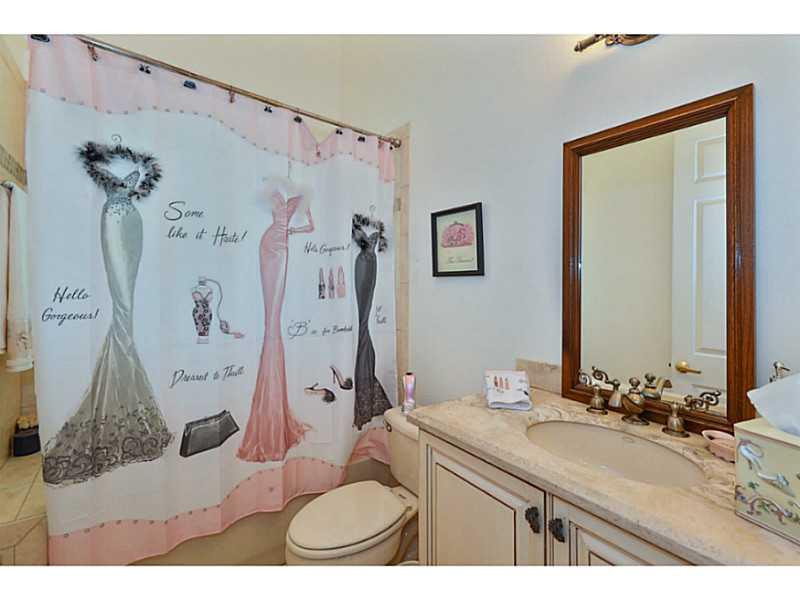 7070 Northwest Turtle Walk Boca Raton, FL 33487 - Photo 10 of 10 a bathroom with a granite countertop sink mirror vanity and shower