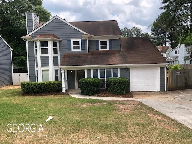 1238 Winston Drive Decatur, GA 30032 - Photo 1 of 1 a front view of a house with a yard