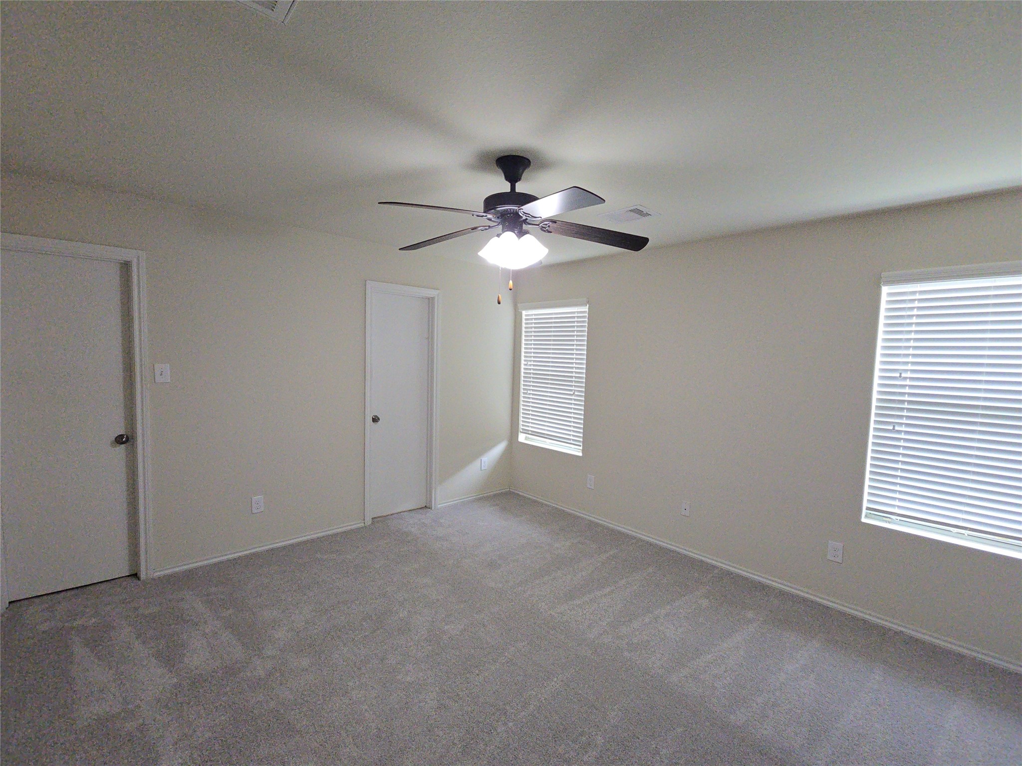 810 Lightningbug Lane Conroe, TX 77301 - Photo 7 of 27 a view of an empty room with a ceiling fan