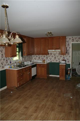 150 Driver Subdivision Prospect, TN 38477 - Photo 10 of 13 a kitchen with stainless steel appliances granite countertop a stove a sink and a refrigerator