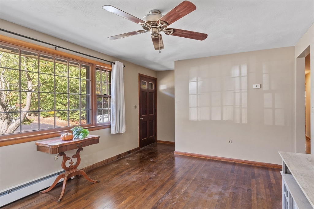 9 Nancy Drive Rutland, MA 01543 - Photo 4 of 19 a view of a livingroom with furniture window wooden floor and a ceiling fan