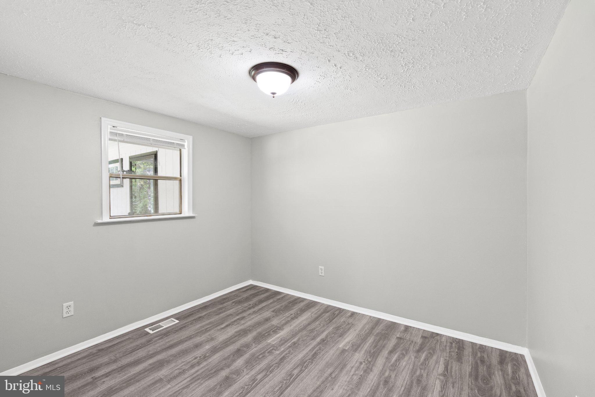 8405 Shirley Road Spotsylvania, VA 22551 - Photo 26 of 42 an empty room with a window