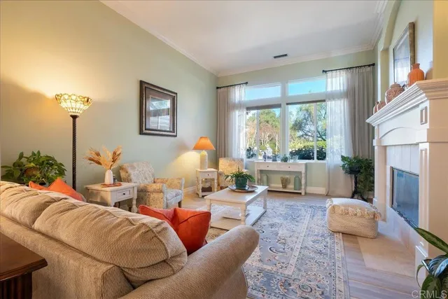 a spacious bedroom with a bed and glass walk in closet