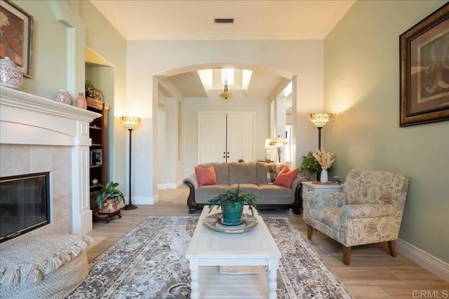 a spacious bedroom with a large bed and a flat screen tv