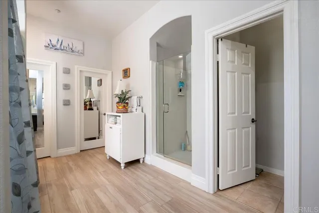 a view of a patio with table and chairs potted plants with wooden fence