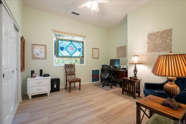 a view of a house with backyard porch and sitting area
