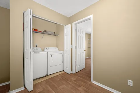 a view of bathroom with a sink and mirror