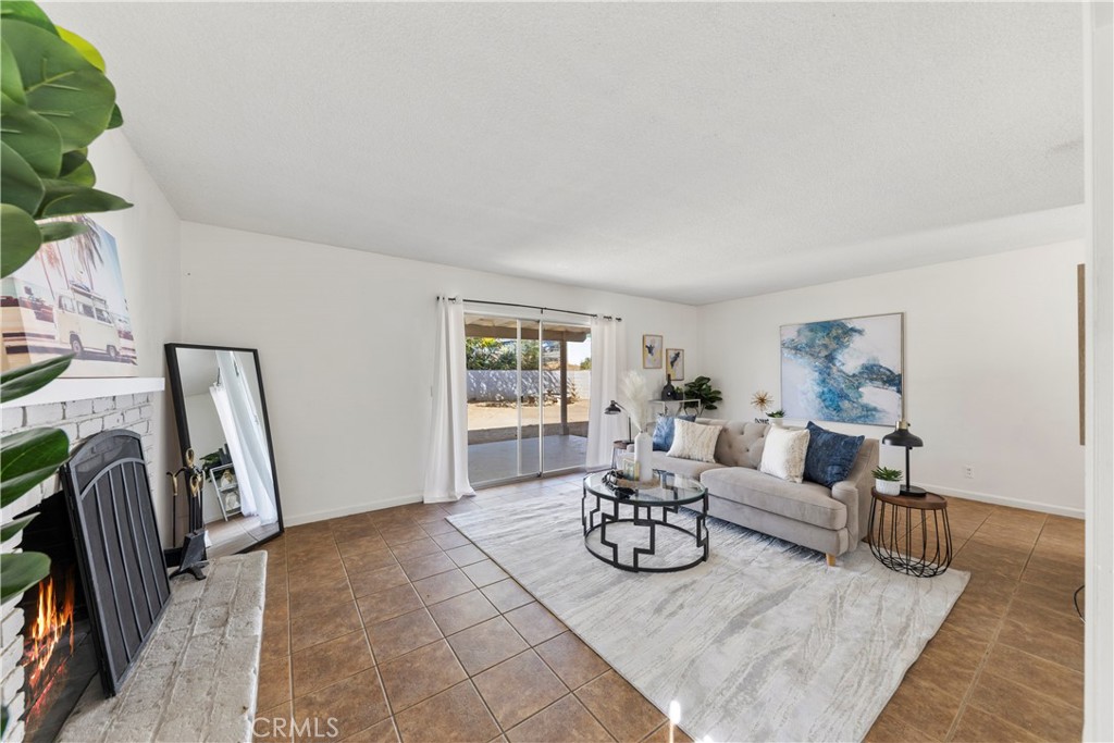 609 Elbrook Drive Fallbrook, CA 92028 - Photo 12 of 30 a living room with furniture a rug and a window