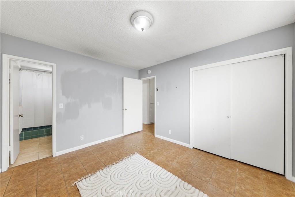 609 Elbrook Drive Fallbrook, CA 92028 - Photo 14 of 30 a bedroom with a bed and a window