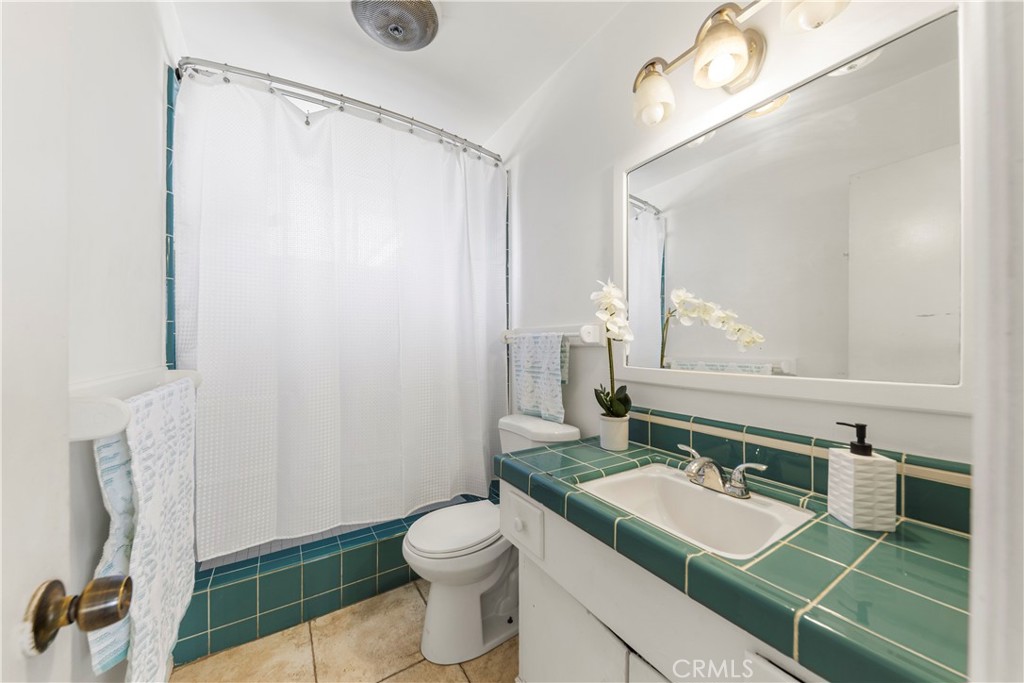 609 Elbrook Drive Fallbrook, CA 92028 - Photo 15 of 30 a bathroom with a sink toilet and shower